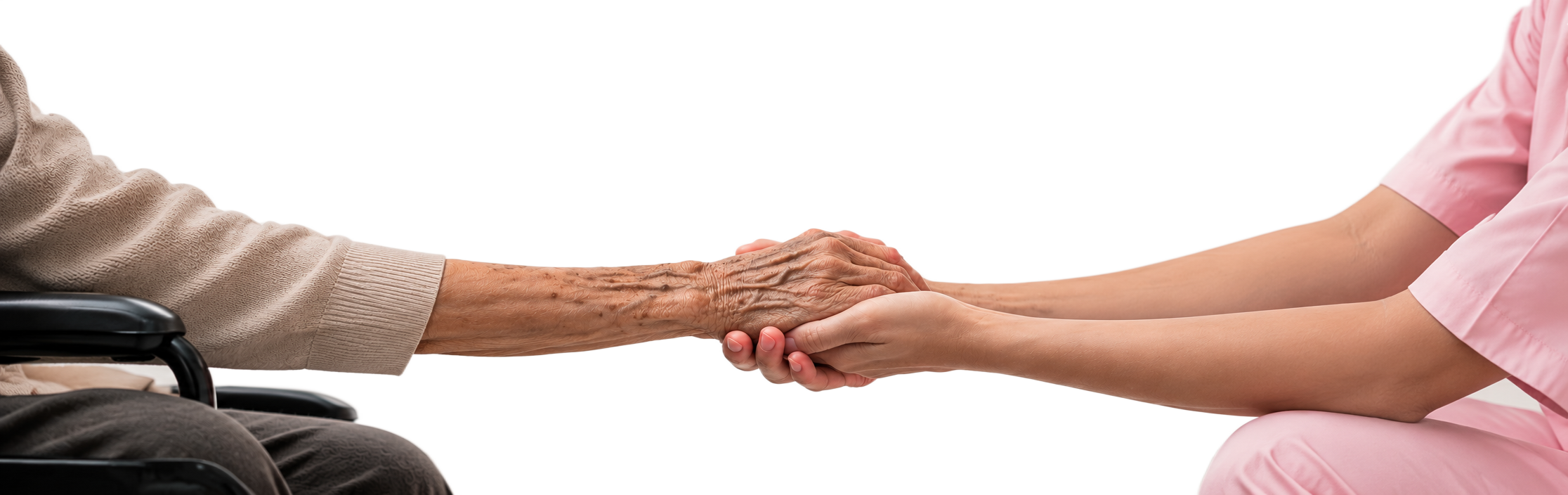 An older person's hands held gently by a caregiver